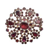 A Georgian flat cut garnet set brooch