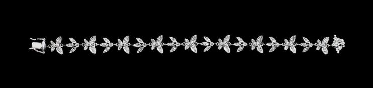 A diamond set butterfly and flower bracelet