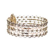 A gold fancy filigree cuff bracelet