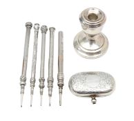 Five Sampson Mordan silver propelling pencils, a dwarf candlestick and a double sovereign holder