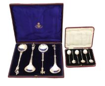 Two cased sets of silver spoons