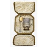 A cased Victorian silver gilt Christening mug and spoon