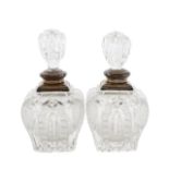 Two Edward VII silver mounted cut glass perfume bottles