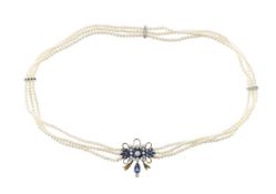 A platinum seed pearl multi strand choker with sapphire and diamond centre piece