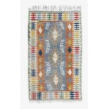 A contemporary kilim rug