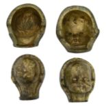 A pair of bronze doll head moulds