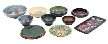 A James Macintyre and nine Moorcroft pottery trays and bowls