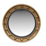 A Regency style gilt convex mirror