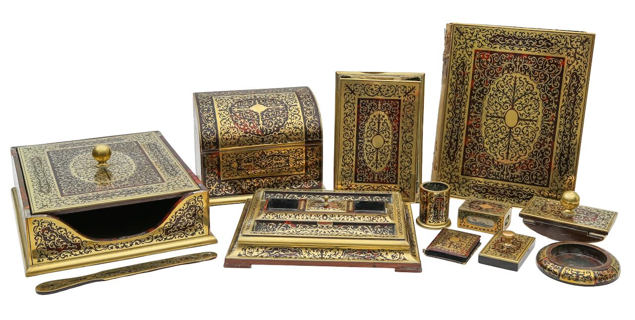 An Edwardian eleven piece boullework desk set
