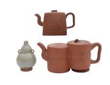 Two Chinese Yixing terracotta teapots and a celadon glazed double gourd vase