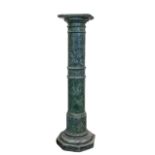 A serpentine green marble column