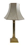 A brass Corinthian column table lamp