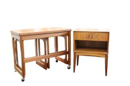 McIntosh & Co. Ltd: A teak bedside cabinet and an associated next of tables