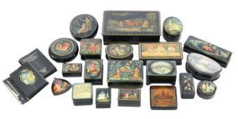 A collection of nineteen Russian lacquer boxes and a hanging decoration