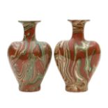 A pair of agateware bottle vases