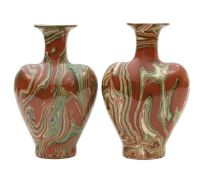 A pair of agateware bottle vases