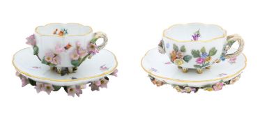 Two sets of Meissen porcelain encrusted teacups and saucers