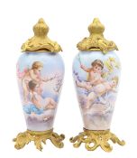 A pair of French enamel and ormolu mounted vases