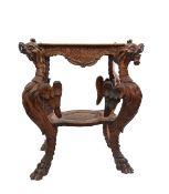 A carved walnut two tiered side table