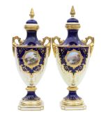 A pair of Coalport porcelain vases and covers