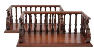A pair of mahogany book racks,