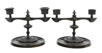 A pair of bronze candlesticks