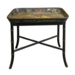 A Regency Chinoiserie gilt and black lacquered papier mache tray on stand,