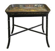A Regency Chinoiserie gilt and black lacquered papier mache tray on stand,
