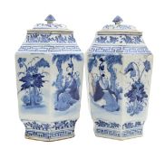 A pair of Chinese blue and white vases and covers
