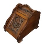 An Arts and Crafts oak purdonium