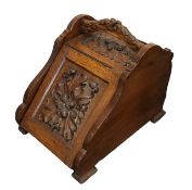 An Arts and Crafts oak purdonium