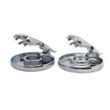 Two chrome Jaguar car mascot ashtrays