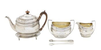 A George III silver four piece tea service and sugar tongs