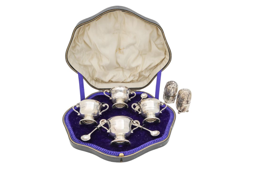A cased George V silver cruet set, and two Victorian pepperettes - Image 1 of 3