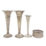 Two Edward VII and a George V silver vase, and a silver mounted coaster