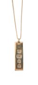 A 9ct gold ingot on chain
