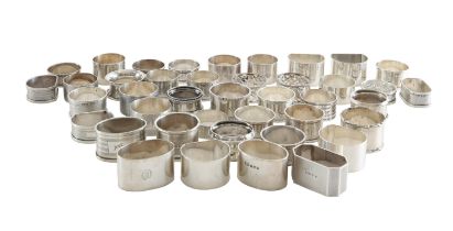 A large collection of silver napkin rings