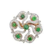 A demantoid garnet and diamond brooch