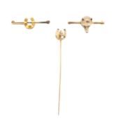 A fox head brooch and two horse shoe pin brooches