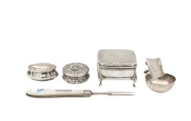 A group of three Victorian silver boxes, a mother of pearl fruit fork, and a cigar rest