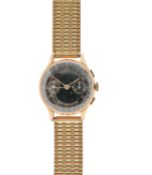 A Baume & Mercier 18K gold manual wind chronograph wristwatch