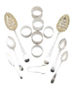 A collection of George III and later silver flatware, and napkin rings