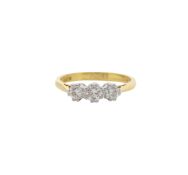 An 18ct gold three stone diamond ring