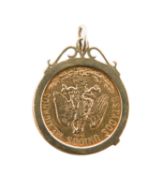 A Mexican 1906 cinco pesos gold coin in a mount