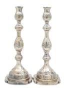 A pair of George VI silver Shabbat candlesticks
