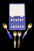 Four Danish silver gilt Christmas spoons, and a cased sets of silver coffee spoons