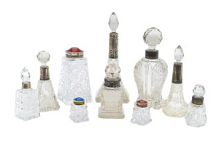 A collection of silver mounted and cut glass perfume bottles