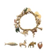 An 18ct gold textured chain with 9ct and other charms