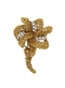 A French diamond set gold brooch