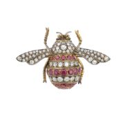 A diamond and ruby bee brooch